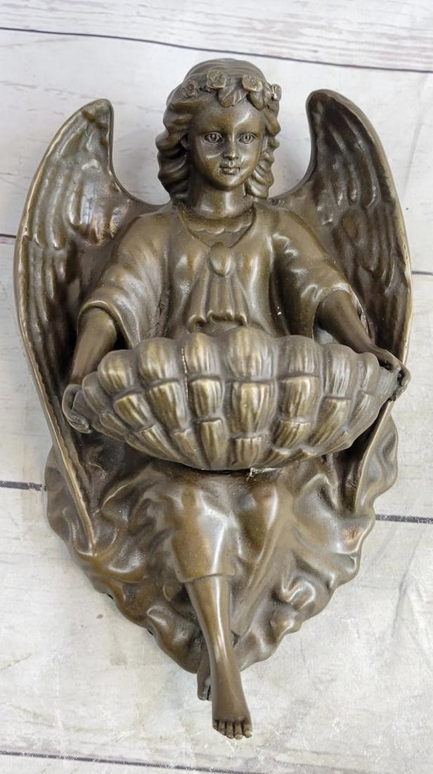 Original Milo Young "Guardian Angel" Bronze Wall Sconce Bronze - 4lbs: A young Guardian Angel is the focal point of this fascinating wall mount sculpture. His kegs curve and transform into a heart shaped, creating the place for your dreams. The boy sits with a cloth cove