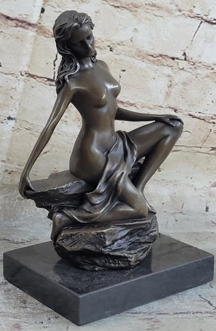Exquisite Nude Female Bronze Sculpture: Exquisite Nude Female Bronze Sculpture This pose of a peaceful girl sitting with downcast eyes captures the true rebirth of the innocence age. The artist was able to depict elegant nudity that even su