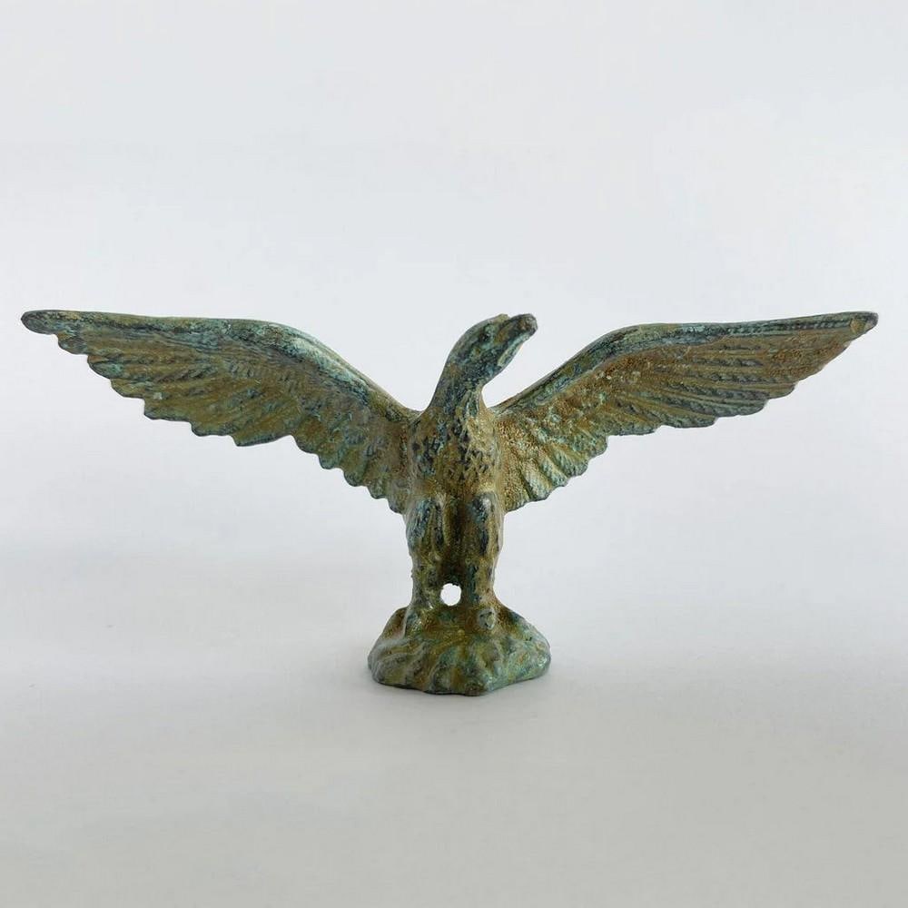 Soaring Bronze Eagle Sculpture - (0.9lbs): Soaring Bronze Eagle Sculpture - (0.9lbs) A stunning bronze eagle statuette, featuring intricate patterns carved into the bronze. Its ideal size makes it a perfect addition to desks or shelves for a