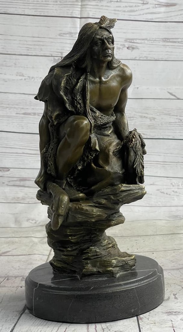 Signed Original Warrior Squatting On Rock Bronze Sculpture - 13" x 6.5": Signed Original Warrior Squatting On Rock Bronze Sculpture - 13" x 6.5" A Native American warrior sits on a rugged stone. He grasps his hand-carved spear firmly in his hand. As he leans and re