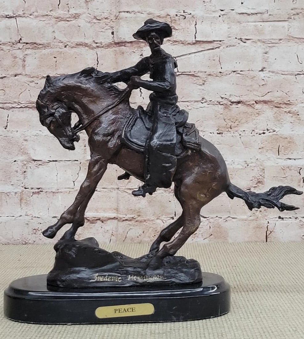 Western Cowboy Peace Bronze Sculpture - 10" x 10": Western Cowboy Peace Bronze Sculpture - 10" x 10" A cowboy charges across the dry land with his gun in the air. His horse gallops, with its nose pointed forward. The cowboy holds the reins tig