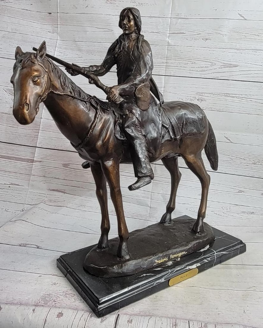 James Fraser PEACE Native American Indian on Horseback Bronze Sculpture Western: This is a particularly detailed sculpture of a Native American man on his horse. The horse is young but strong and stands calmly as the rider cocks his riffle, the reigns hanging loosely around his ne