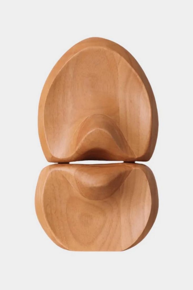 Echoes in Wood Sculpture: Echoes in Wood Sculpture An interplay of flowing curves, angles, and voids, this abstract wood sculpture draws the eye through its organic silhouette and rich natural texture. Hand-carved to emphasize