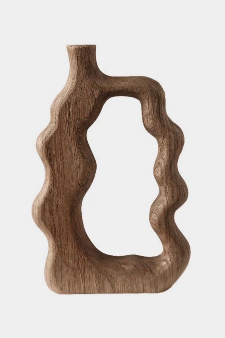 Hollow Form Wooden Abstract Sculpture: Hollow Form Wooden Abstract Sculpture A sculptural piece shaped by nature and hand, this minimalist wood form features an organic contour with a central void. The raw grain and fluid silhouette invite