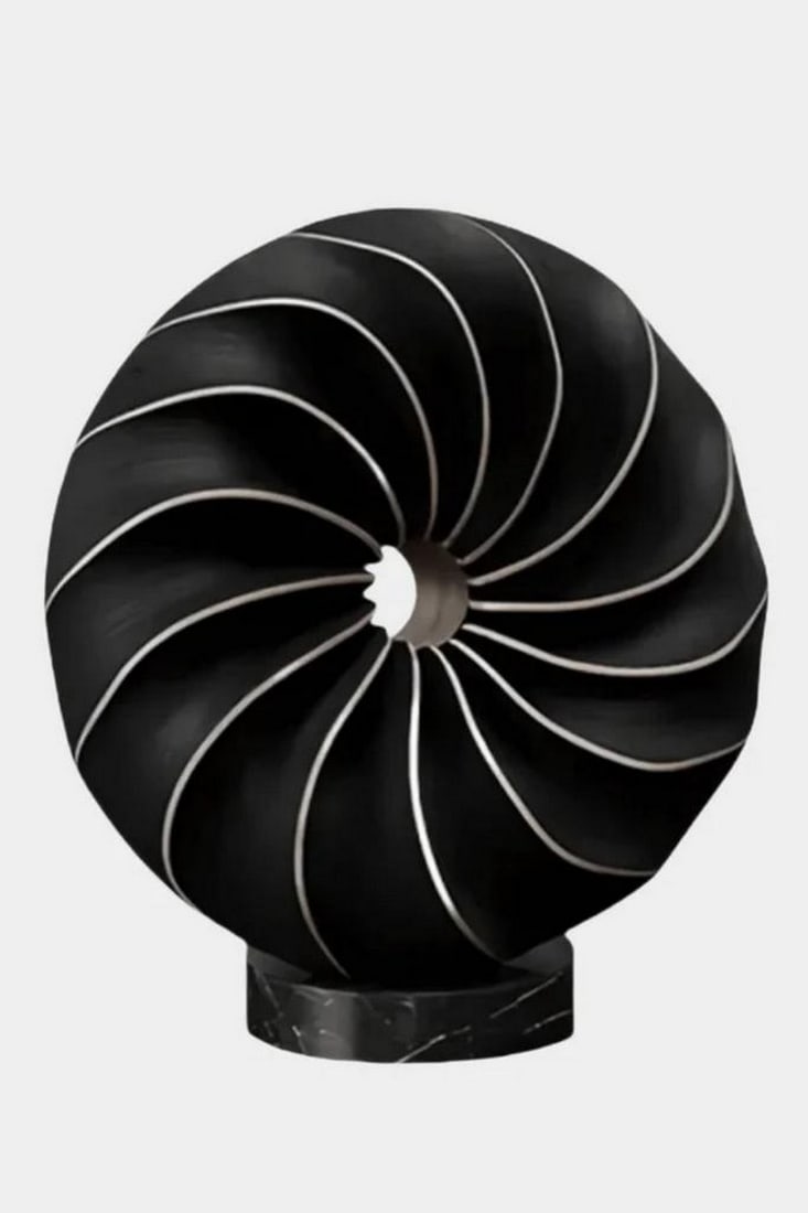 “Heartwood Spiral?? Wooden Sculpture: “Heartwood Spiral” Wooden Sculpture Rooted in the timeless language of the forest, this sculpture swirls with the quiet power of nature’s design. Its flowing contours mimic the motion of
