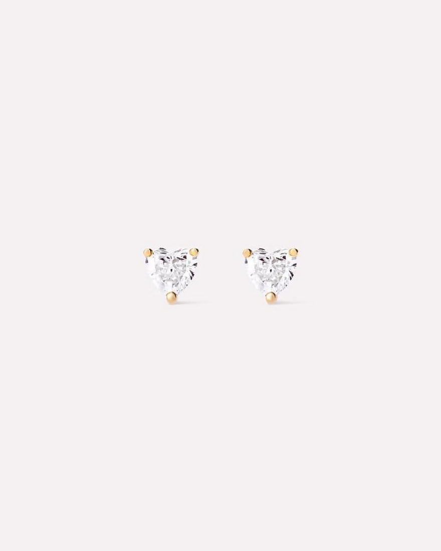 Solid Gold Heart Stud Earrings: Solid Gold Heart Stud Earrings These earrings are crafted from recycled solid yellow gold and feature heart-shaped lab-grown diamonds. Designed for durability, they are resistant to water and tarnish