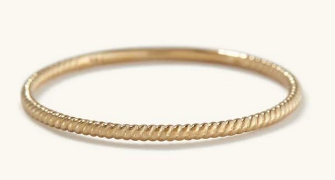 Gold Helix Ring: Gold Helix Ring Graceful and sculptural, the 14K Gold Helix Ring features a gently spiraled design that catches the light with every movement. Crafted in rich yellow gold, this ring brings a touch of