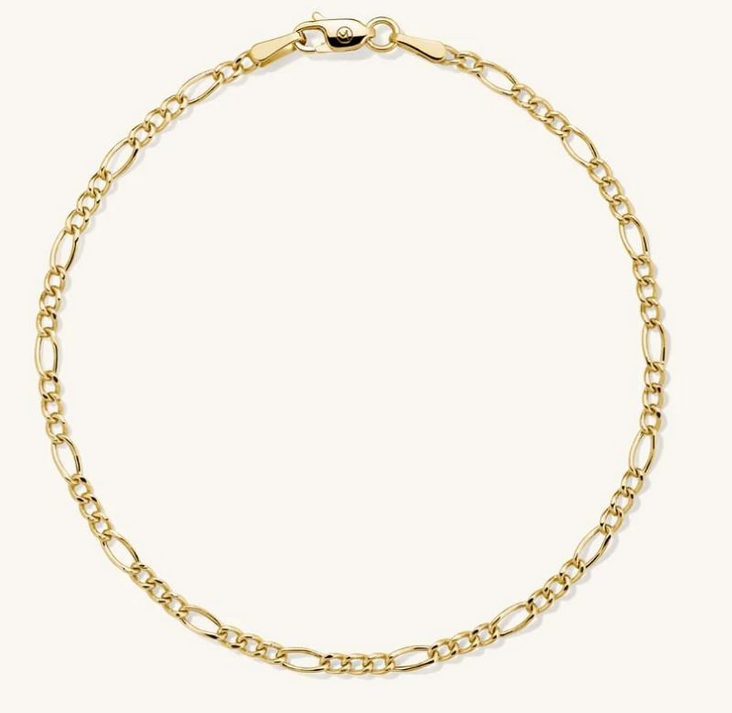 Classic Figaro Link Chain Bracelet: Classic Figaro Link Chain Bracelet Classic and effortlessly stylish, this Figaro chain bracelet features a timeless pattern of alternating short and elongated links. Crafted in polished metal with a