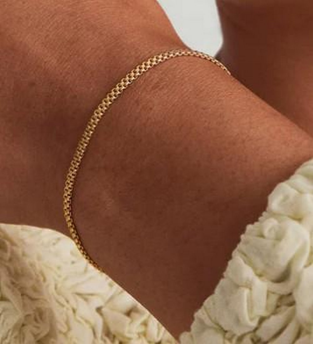 Bold Polished Spheres Bracelet: Bold Polished Spheres Bracelet Statement-making and sculptural, this bracelet features a strand of high-shine metal spheres in a bold, uniform silhouette. Its smooth, reflective surface adds instant