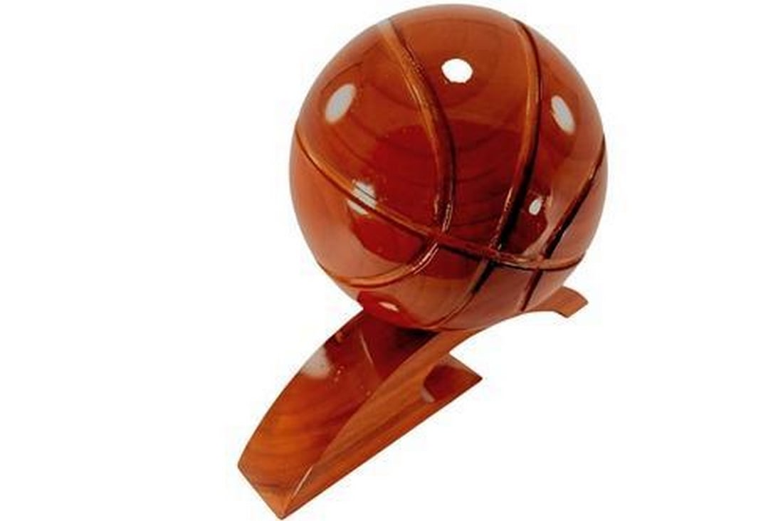 Wooden Basketball: Wooden Basketball Very Unique item and a perfect gift. Perfect for any "Man Cave". The Basketball has a diameter of 7", 10" tall and 12" long base. View photos for further details.