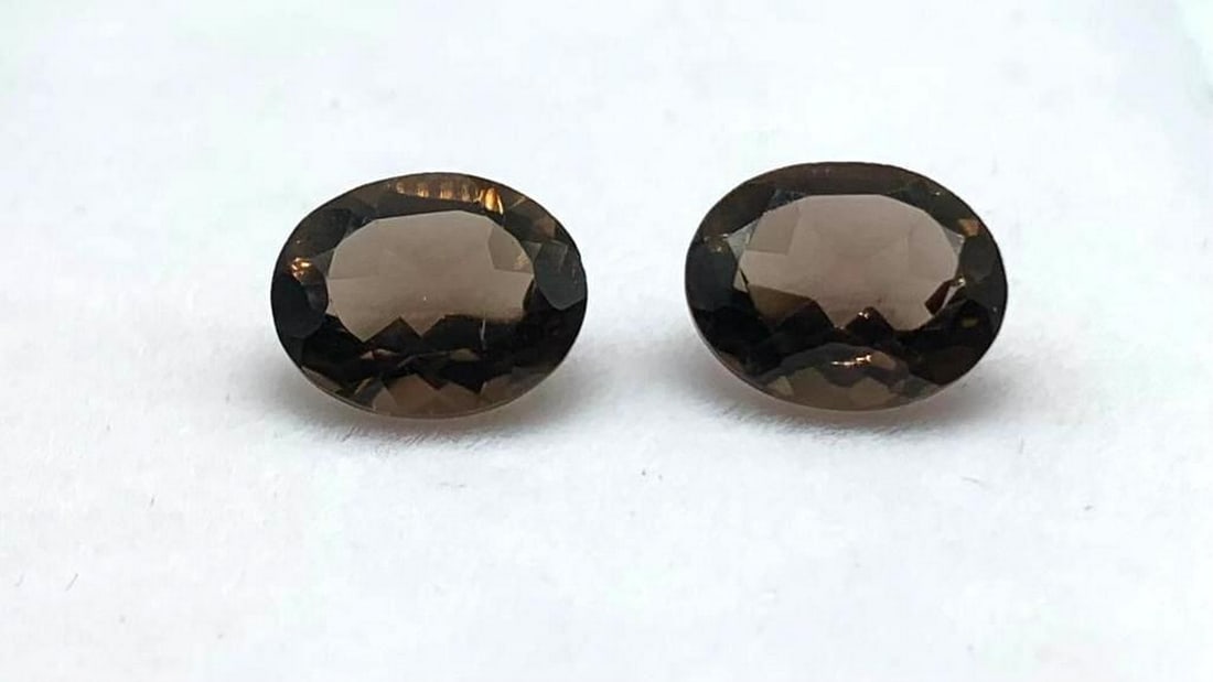 9.1 X 8.2mm Matching Oval Smoky Quartz Pair: 9.1 X 8.2mm Matching Oval Smoky Quartz Pair Quartz enhances spiritual growth, spirituality and wisdom. It clarifies thought processes and emotions, it can increase inspiration and creativity. It can