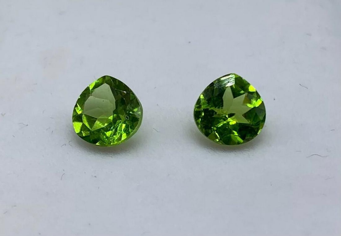 4ct Pear Tear Drop Cut Green Apple Peridot Pair: 4ct Pear Tear Drop Cut Green Apple Peridot Pair Size: 7.8mm x 7.8mm Total Carat Weight: 4.00ct Untreated Lot Contains 2 Gems Bright green hues and great clarity make this stone a grea