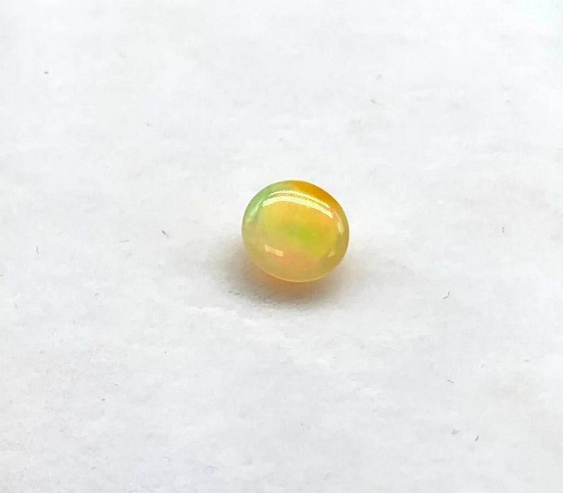 1.036 Round Cut Opal Gemstone: 1.036 Round Cut Opal Gemstone Size: 7mm x 7mm Total Carat Weight: 1.036ct Untreated View Photos For Further Details