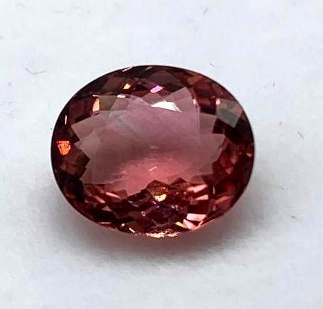 3.25ct Oval Floral Cut Pink Tourmaline Gemstone: 3.25ct Oval Floral Cut Pink Tourmaline Gemstone Size: 10.3 x 8.9mm Total Carat Weight: 3.25ct Untreated Great stone with deep pink hues making it perfect for a center piece in any jewelry item.