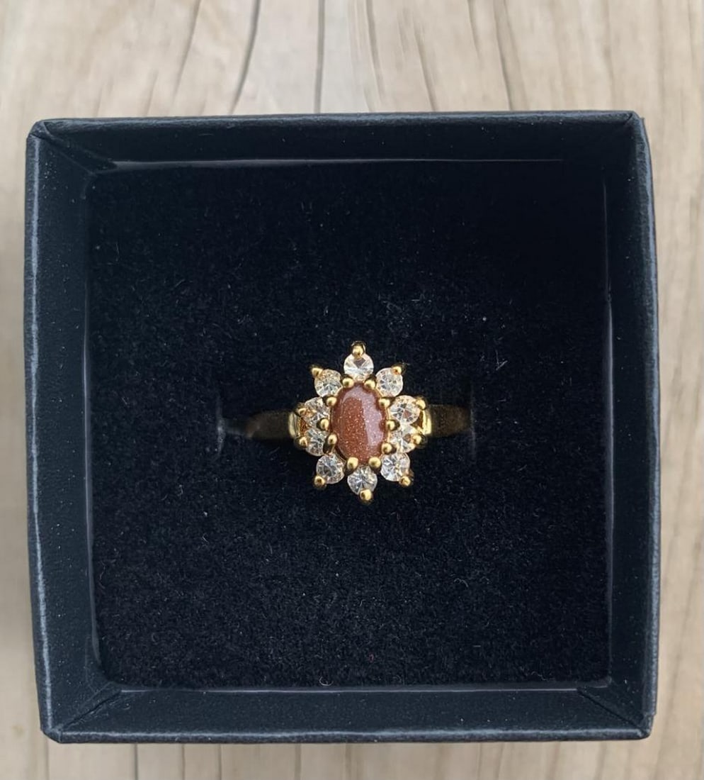 Dolphin Ore Marquise Carnelian Ring: Dolphin Ore Marquise Carnelian Ring This enchanting ring features a 1ct marquise-cut carnelian set in a lustrous 18K gold plated band, designed in the signature Dolphin Ore style. The warm,