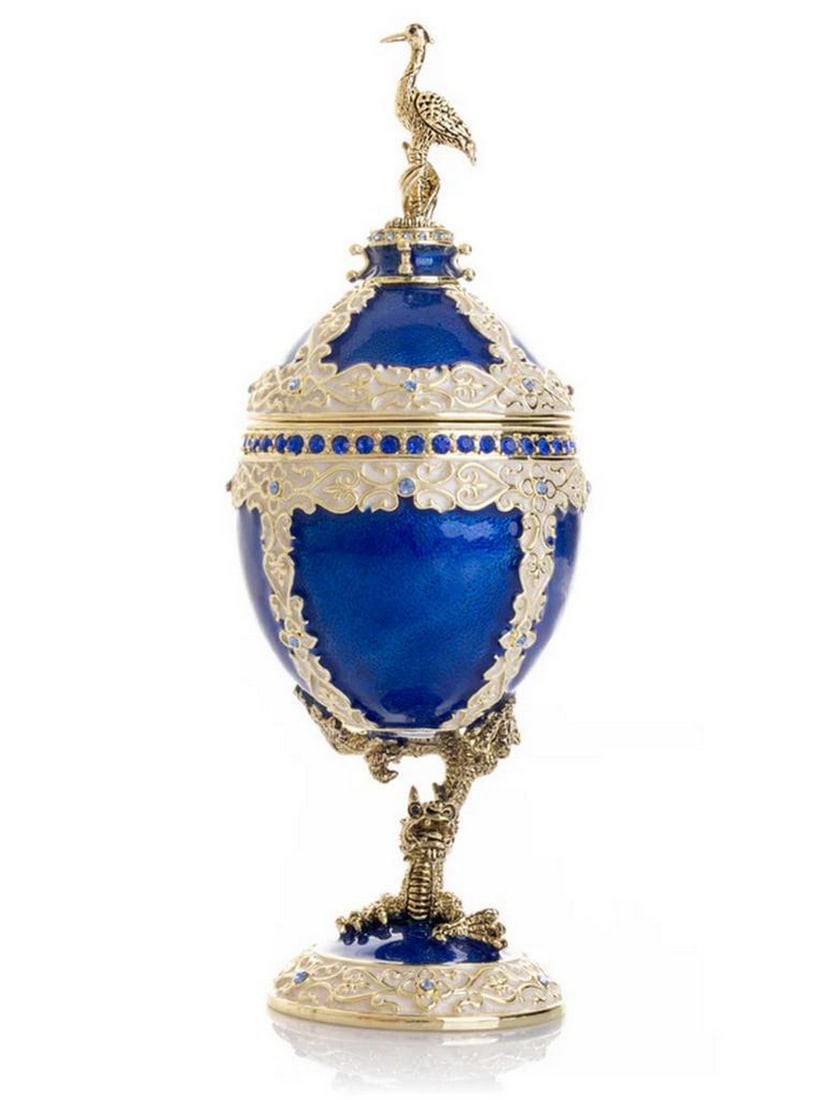 Regal Blue-Gold Egg Clock with Dragon Base and Bird Accent: Regal Blue-Gold Egg Clock with Dragon Base and Bird Accent This enamel painted ornamental egg, decorated with Austrian crystals, is handmade and plated with 24K gold. Crystals are handpicked and