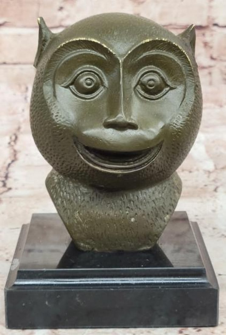 Playful Wisdom: Abstract Bronze Monkey Bust on Marble Base: Playful Wisdom: Abstract Bronze Monkey Bust on Marble Base Whimsical yet refined, this abstract bronze sculpture captures the joyful spirit of a smiling primate with modern artistic flair. The stylize