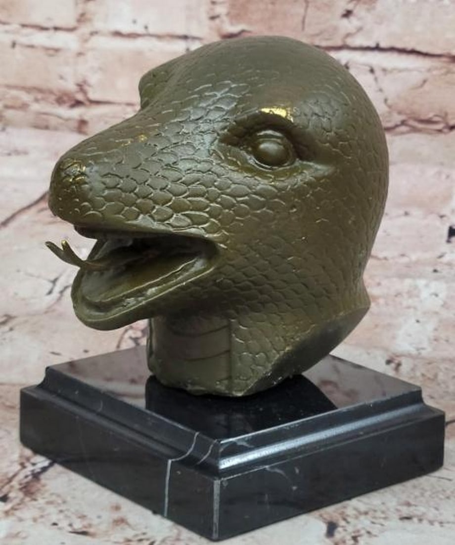 Silent Strike: Bronze Snake Head Sculpture on Marble Base: Silent Strike: Bronze Snake Head Sculpture on Marble Base Sleek and mesmerizing, this bronze snake head sculpture captures the intensity and precision of one of nature’s most enigmatic predators. Wi