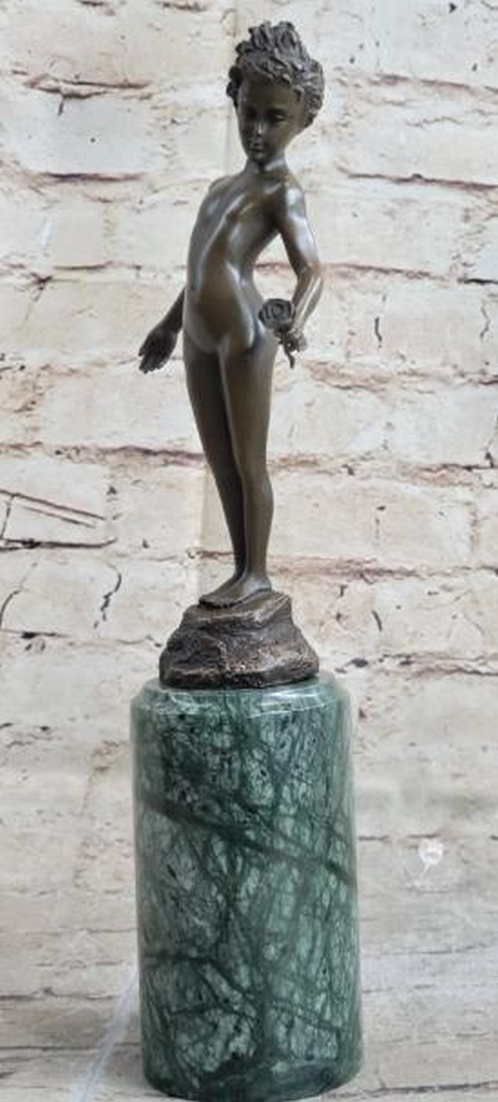 Innocence in Bloom Bronze Sculpture: Innocence in Bloom Bronze Sculpture This delicate reproduction bronze sculpture, bearing the signature of artist Milo, captures the timeless elegance of Art Deco and Nouveau influences. The piece feat
