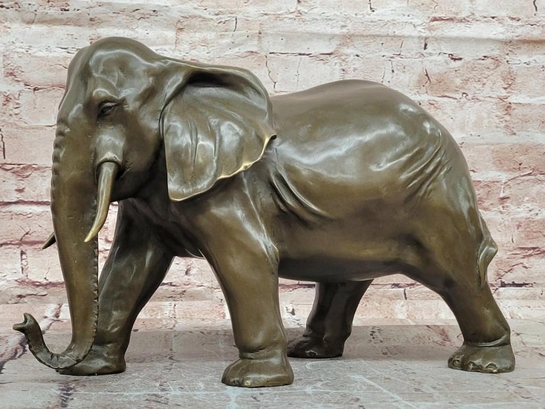 Juno Original Juno Elephant Bronze Sculpture – 9" x 13.5": Juno Original Juno Elephant Bronze Sculpture – 9" x 13.5" This bronze sculpture depicts an elephant, rendered with attention to proportion, detail, and lifelike presence. The composition emp