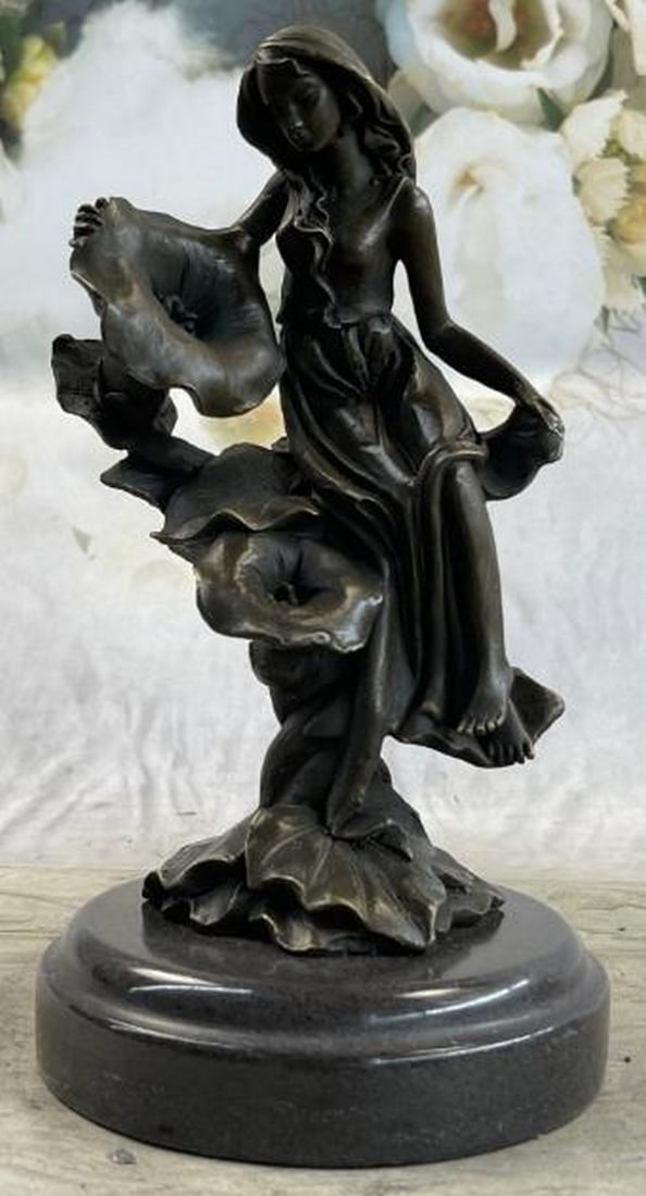 Girl Resting on Flower Bronze Sculpture: Girl Resting on Flower Bronze Sculpture Get lost in a daydream. She leans back on a tree stump and flowers grow all around her. She stretches an arm out to feel the blossom graze her skin. She is one 