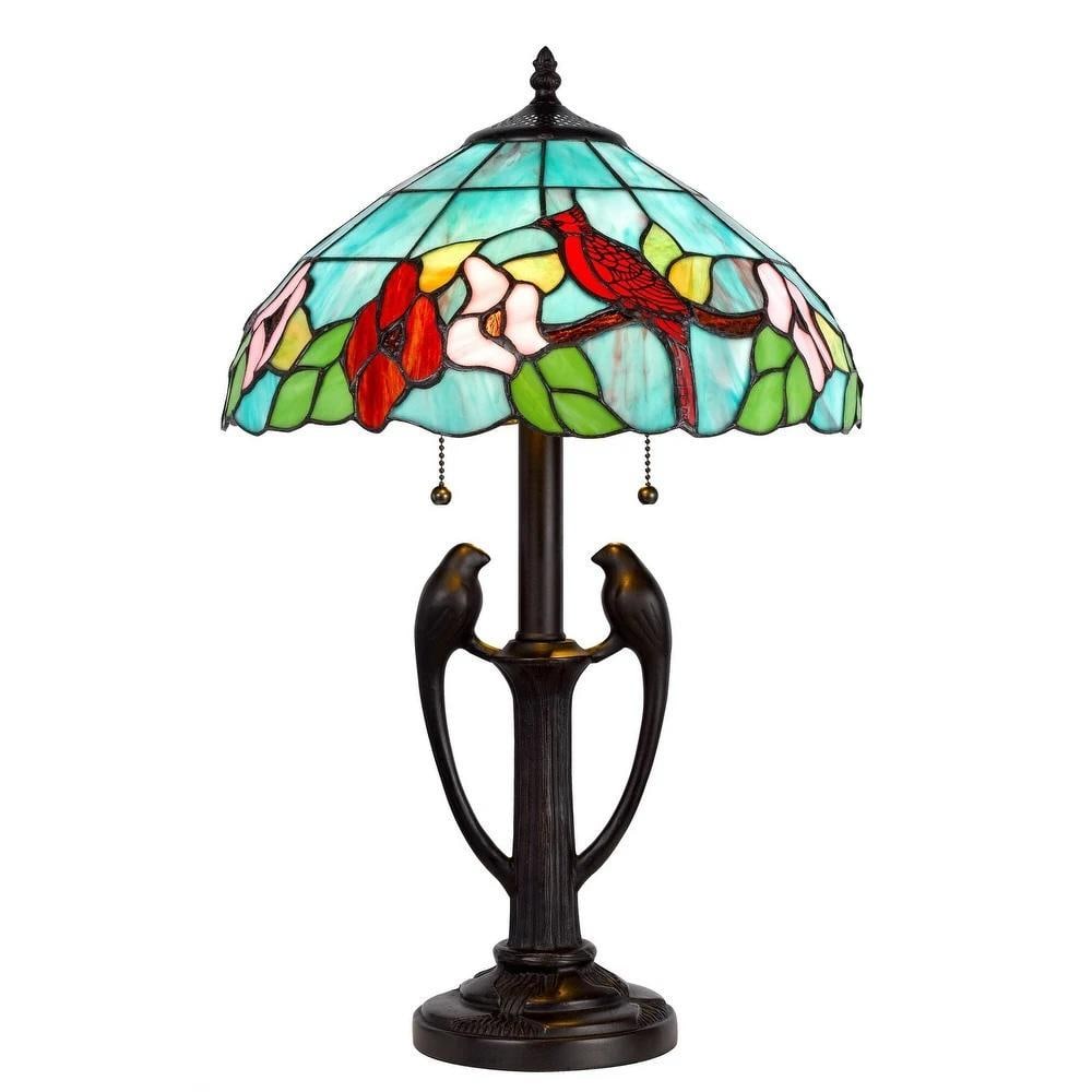 Aviary Glow Tiffany Table Lamp: Aviary Glow Tiffany Table Lamp This 22-inch Tiffany table lamp features a hand-painted stained glass shade with vibrant patterned colors and delicate bird accents. The dark-toned metal base is circula