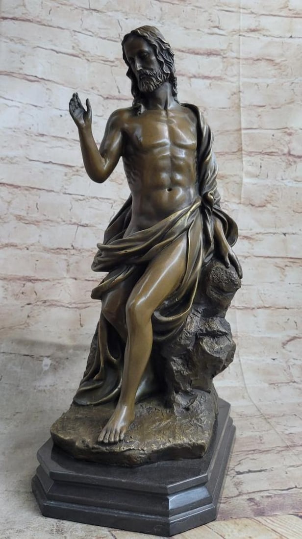 Handmade Bronze Sculpture of Jesus Christ by Valli - 17" x 9": Handmade Bronze Sculpture of Jesus Christ by Valli - 17" x 9" This exquisite handmade bronze sculpture depicts Jesus Christ seated on a rock, draped in a flowing robe that gracefully entwines 