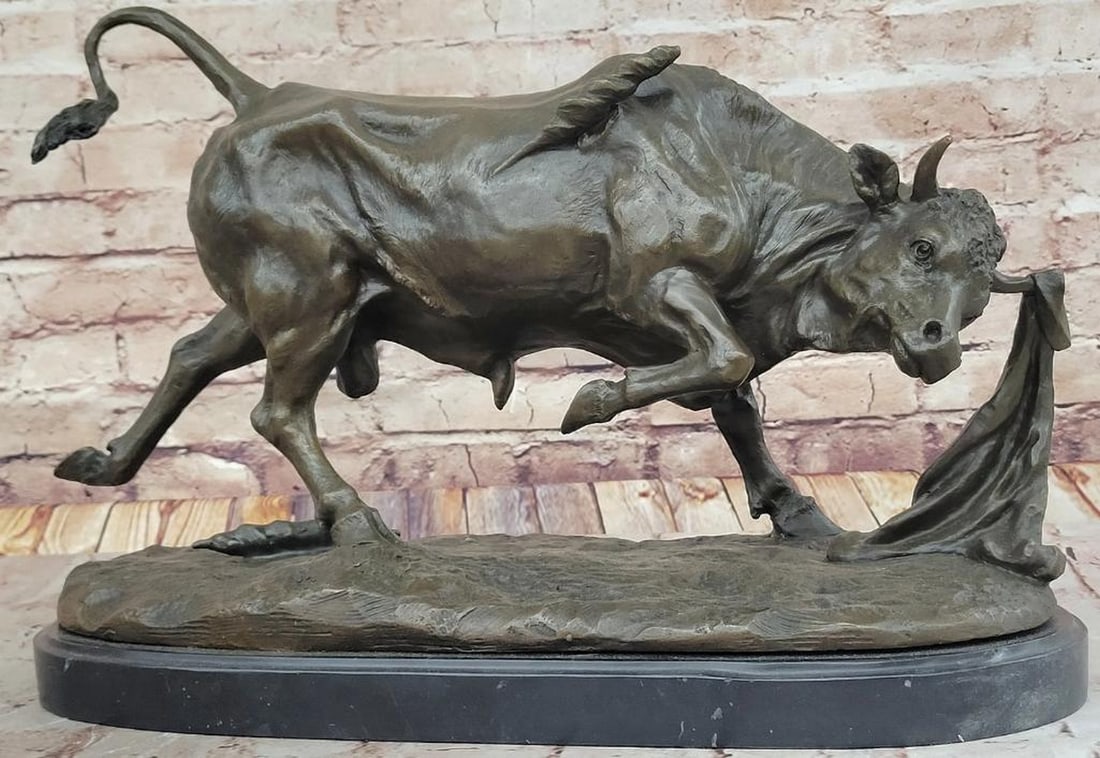 Charging Bull Bronze Sculpture Inspired by P. Comolera - 11" x 18": Charging Bull Bronze Sculpture Inspired by P. Comolera - 11" x 18" This masterfully crafted bronze sculpture captures the raw energy and determination of a charging bull, its powerful stance a