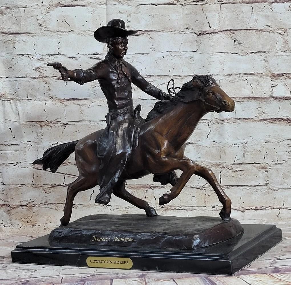 Cowboy on Horse Western Bronze Sculpture - 15" x 18": Cowboy on Horse Western Bronze Sculpture - 15" x 18" A cowboy charges across the dry land with his gun in the air. His horse gallops, with its nose pointed forward. The cowboy holds the reins 