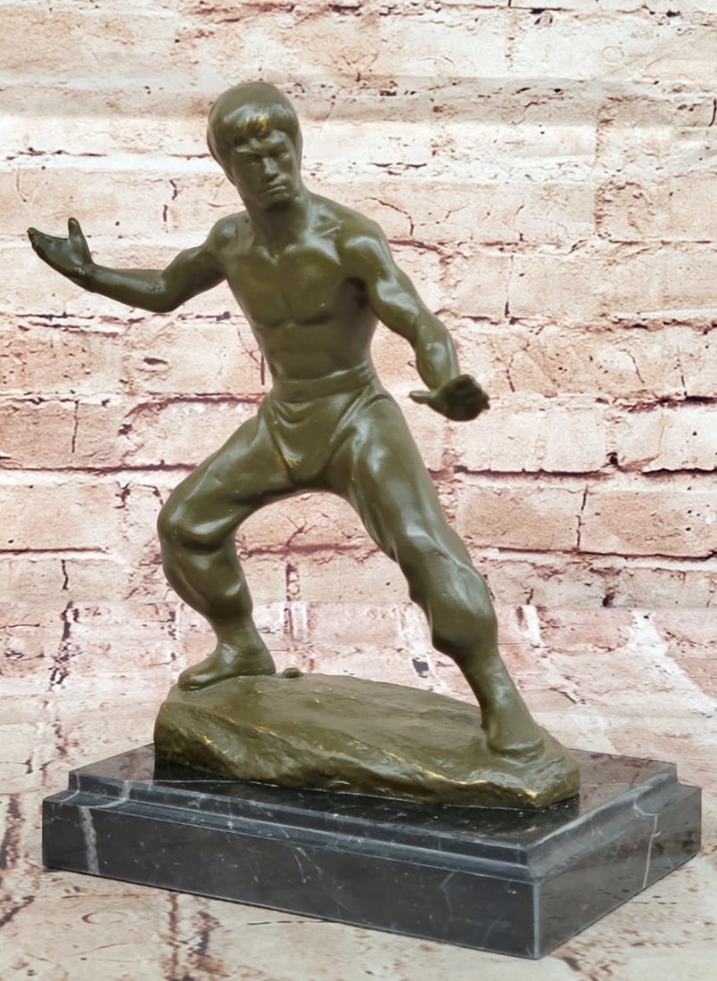 Bruce Lee in Fighting Stance Original Bronze Statue - 10" x 7": Bruce Lee in Fighting Stance Original Bronze Statue Honor the legacy of a true cultural icon with this limited edition Star of the Century Bruce Lee bronze sculpture by artist Mavchi. Captured in a dy
