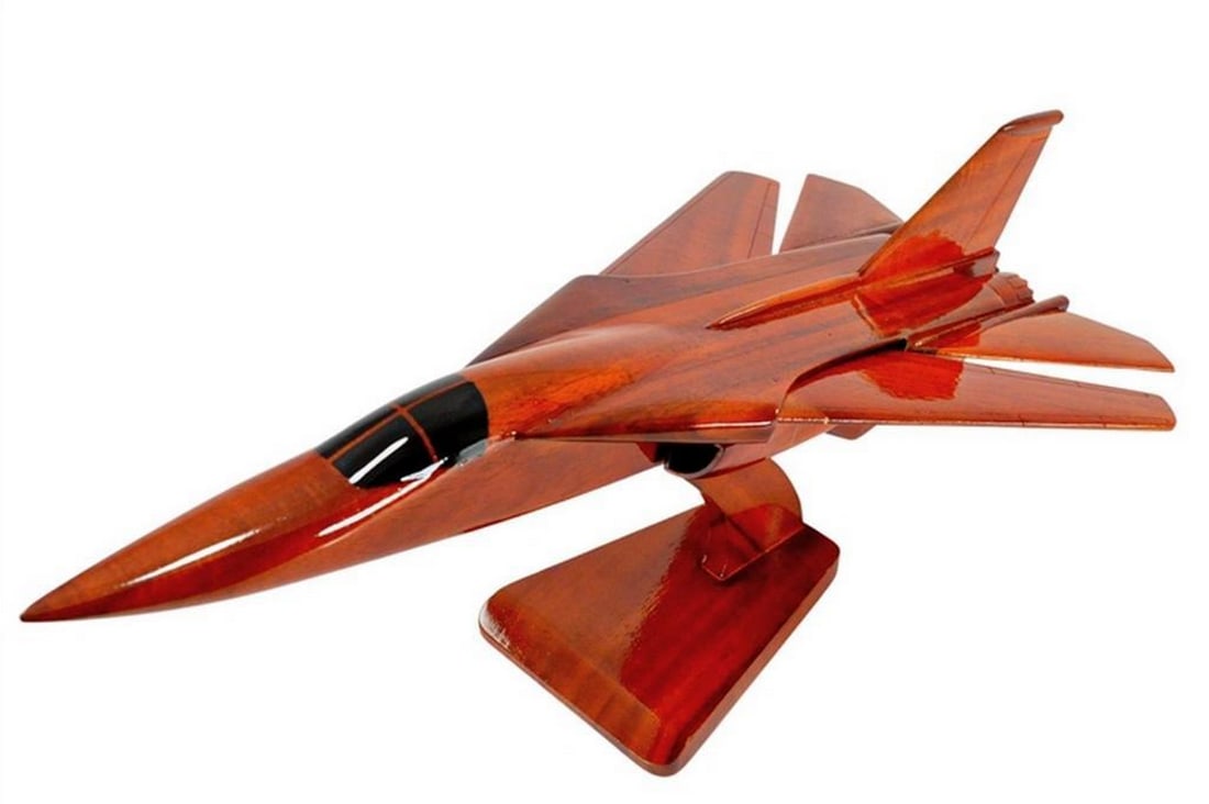 F-111 AARDVARK Wooden Scale Model: F-111 AARDVARK Wooden Scale Model The supersonic F-111 is meticulously recreated in solid mahogany. This jet boasts intricate detailing and a high gloss finish that showcases the luxurious wood grain.