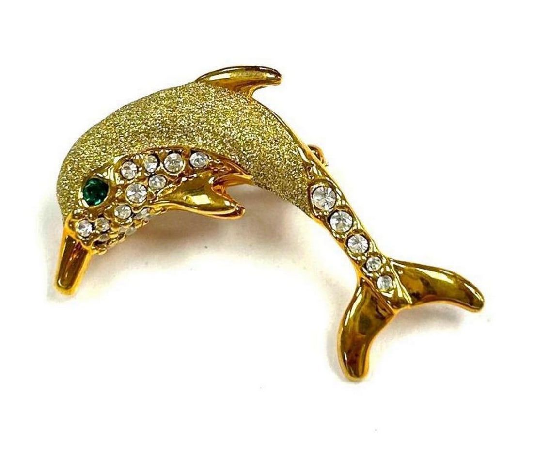18KTGP Dancing Dolphin Brooch With Inset Austrian Crystals & Brilliant Green Gemstone Eye: 18KTGP Dancing Dolphin Brooch With Inset Austrian Crystals & Brilliant Green Gemstone Eye. The Dolphin Brooch Symbolizes Intelligence, Communication, Understanding & Playfulness. A Simple But 