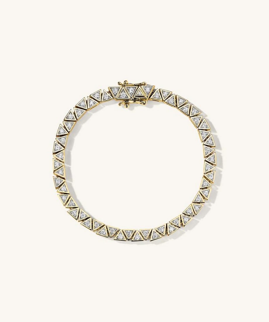 14k Yellow Gold Patra Diamond Tennis Bracelet: 14k Yellow Gold Patra Diamond Tennis Bracelet In a league of its own. Make a bold statement with pieces handcrafted in 14k gold and adorned with responsibly sourced diamonds. Details: - Average Carat