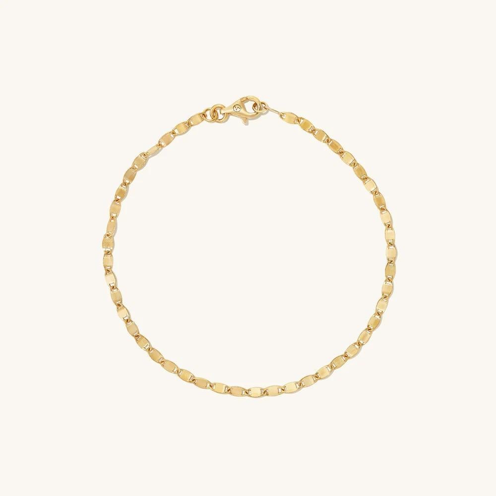 14k Yellow Gold Anchor Chain Bracelet: 14k Yellow Gold Anchor Chain Bracelet A sleek chain with bold styling potential. Handcrafted in 14k solid gold, its interlocking links evoke the strength of a ship's anchor chain. When properly