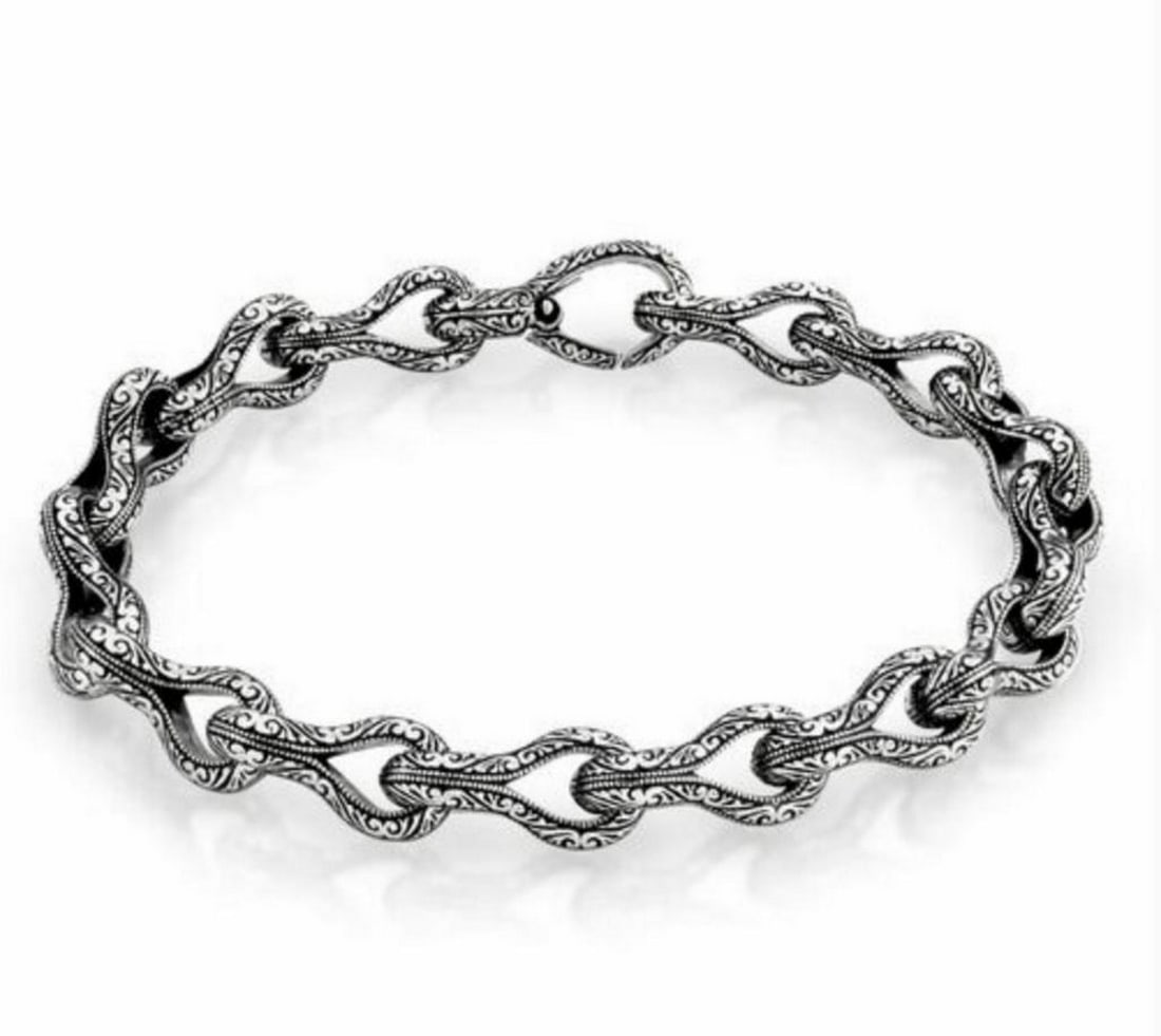 Intricately Woven 925 Sterling Silver Bracelet with Elaborate Engraving: Intricately Woven 925 Sterling Silver Bracelet with Elaborate Engraving. This bracelet is a beautiful addition to any jewellery collection as it exudes class and exquisiteness through its simple yet t