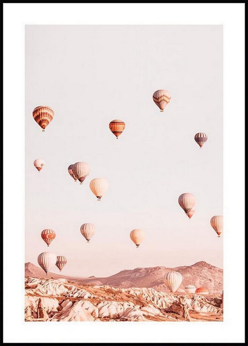 Hot Air Balloons Poster: Hot Air Balloons Poster Photo art poster in soft pastel tones with a dreamy motif of colourful hot air balloons which drift freely over pointy mountain tops towards the light blue sky. The poster has 