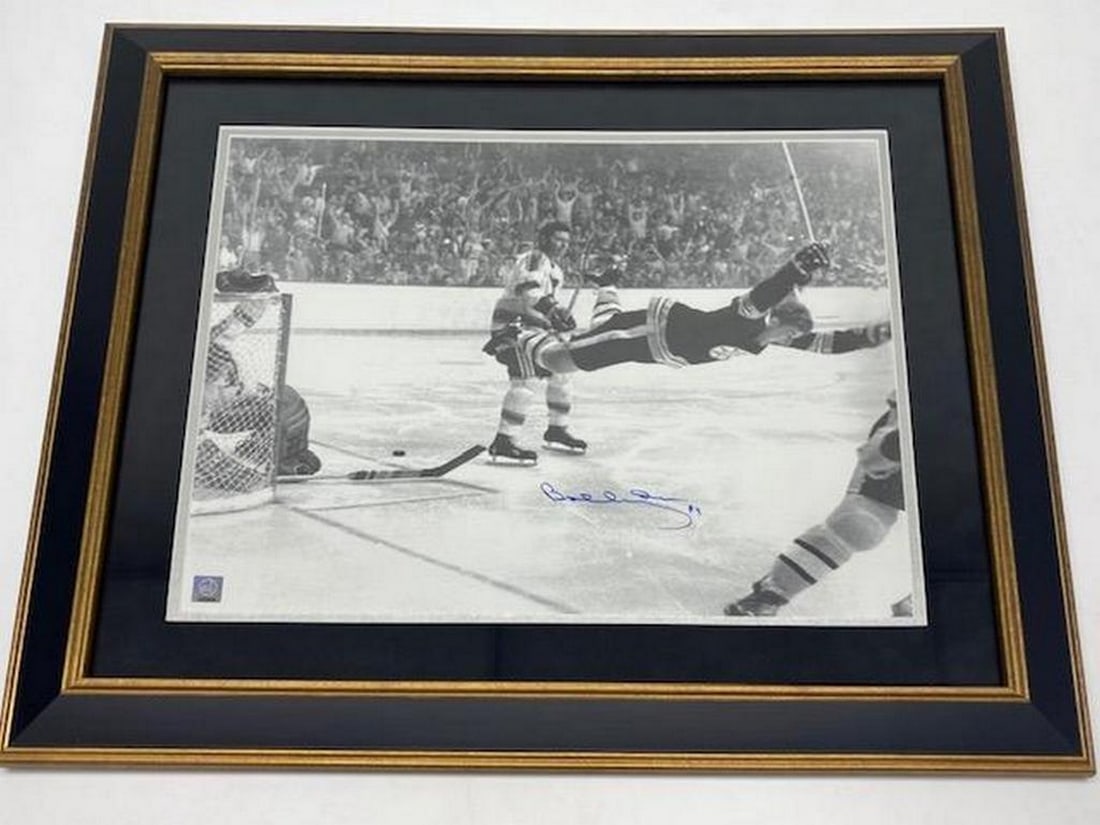 Authentic Bobby Orr "The Flying Goal" Autographed Picture With COA From GWN: An Authentic Bobby Orr 20" x 24" - "The Flying Goal" - Autographed Picture With COA From GWN. Picture Is Custom Framed With Ultra Suede Matting. This Is A Premium Framing Package The T