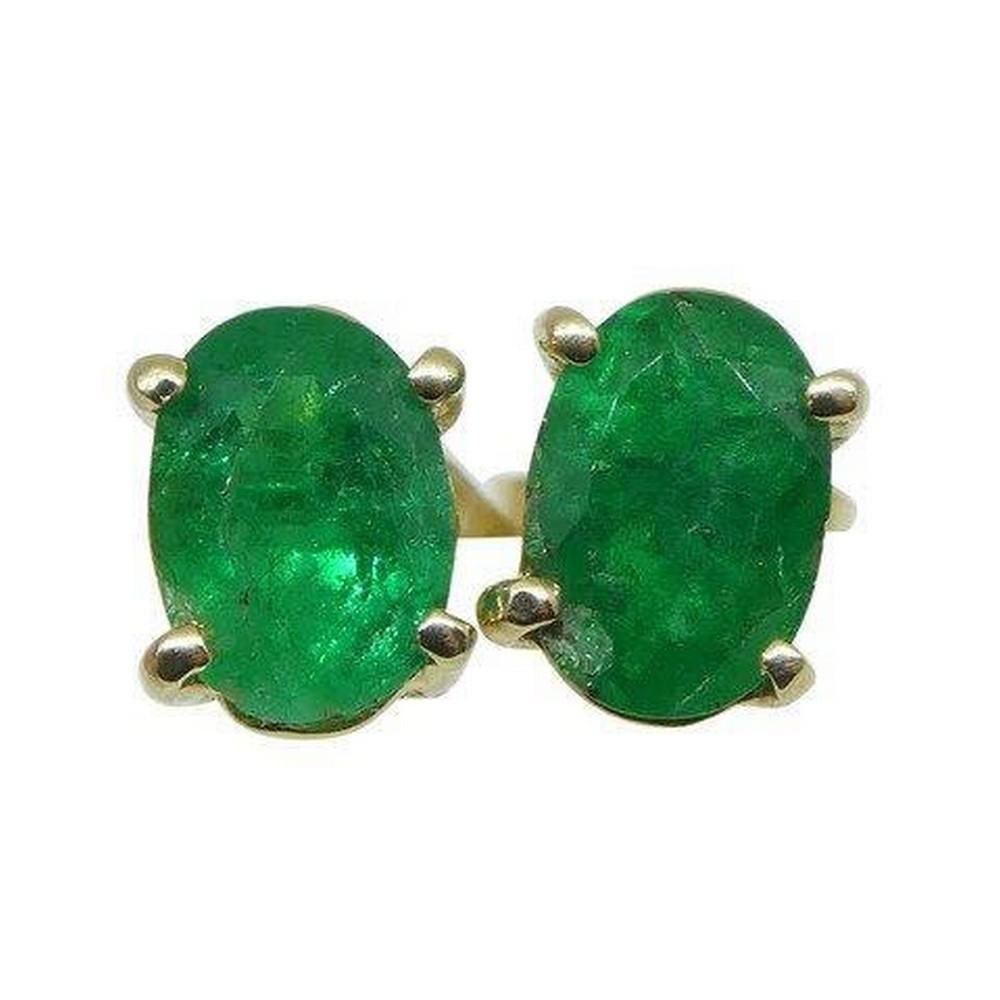 1.03cts Oval Cut Columbian Emerald set in 14k Yellow Gold Earrings: Description: Stone Type: Emerald Number of Stones: 2 Weight: 1.03 carats total weight Measurements: 6.11 x 4.21 x 3.01 mm / 5.82 x 4.19 x 3.40 mm Shape: Oval Cutting Style