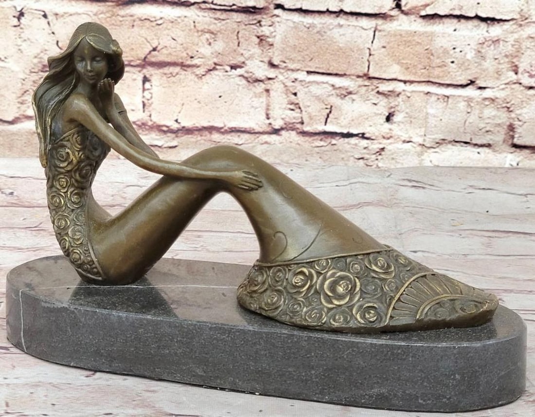 Seated Mermaid Original Bronze Statue - 6" x 9.5": Seated Mermaid Original Bronze Statue - 6" x 9.5" Experience the allure of artistic mastery with this captivating bronze sculpture that radiates elegance and sophistication. Crafted with metic