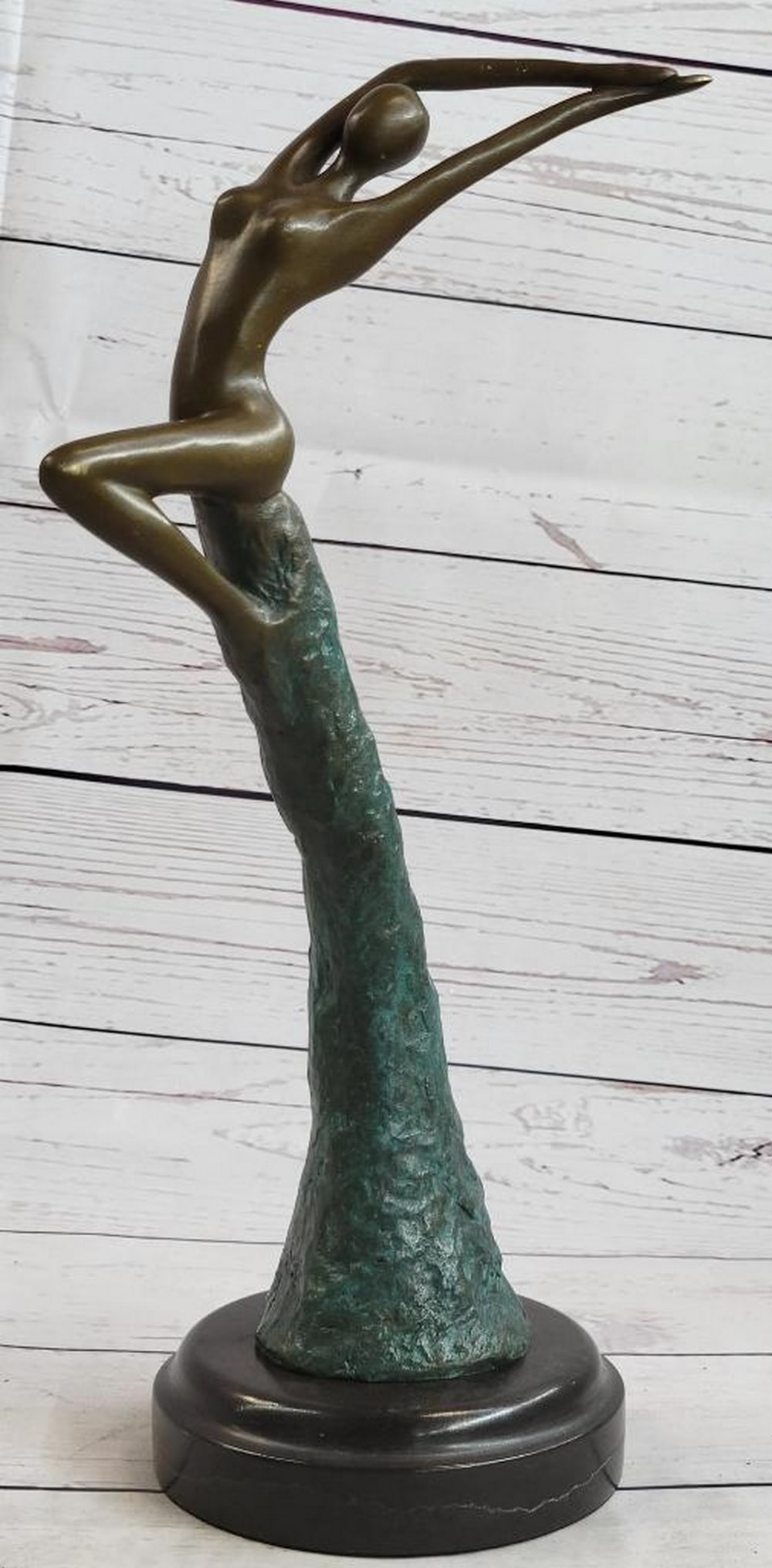 Abstract Leaping Women Inspired Bronze Statue - 14" x 4.5": Abstract Leaping Women Inspired Bronze Statue - 14" x 4.5" The sculpted female figure rides the wave of an otherworldly force, propelling her to the icy heights of the heavens. As she ascends,