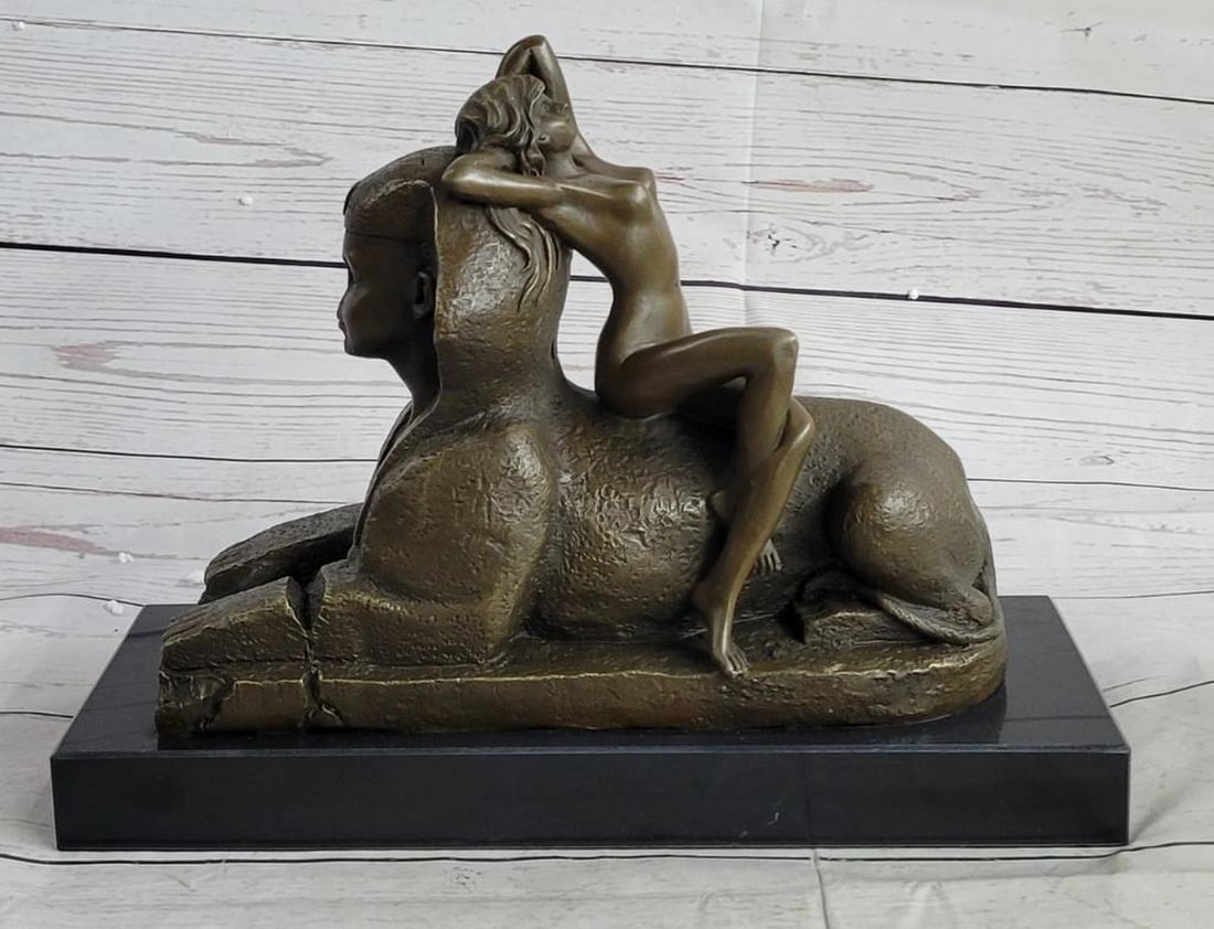 Sphinx and Nude Female Bronze Statue - 9.5" x 12": Sphinx and Nude Female Bronze Statue - 9.5" x 12" This exceptional French Art Nouveau figure by T. Herlinger calls upon classical influences. This stunning work captures a languid beauty loung