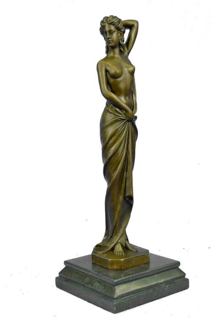 Art Deco Posing Nude Female Inspired Bronze Statue - 14.5" x 5": Art Deco Posing Nude Female Inspired Bronze Statue - 14.5" x 5" Unveil a sculpture that celebrates the human form in its purest essence. This captivating bronze piece captures a woman’s conf