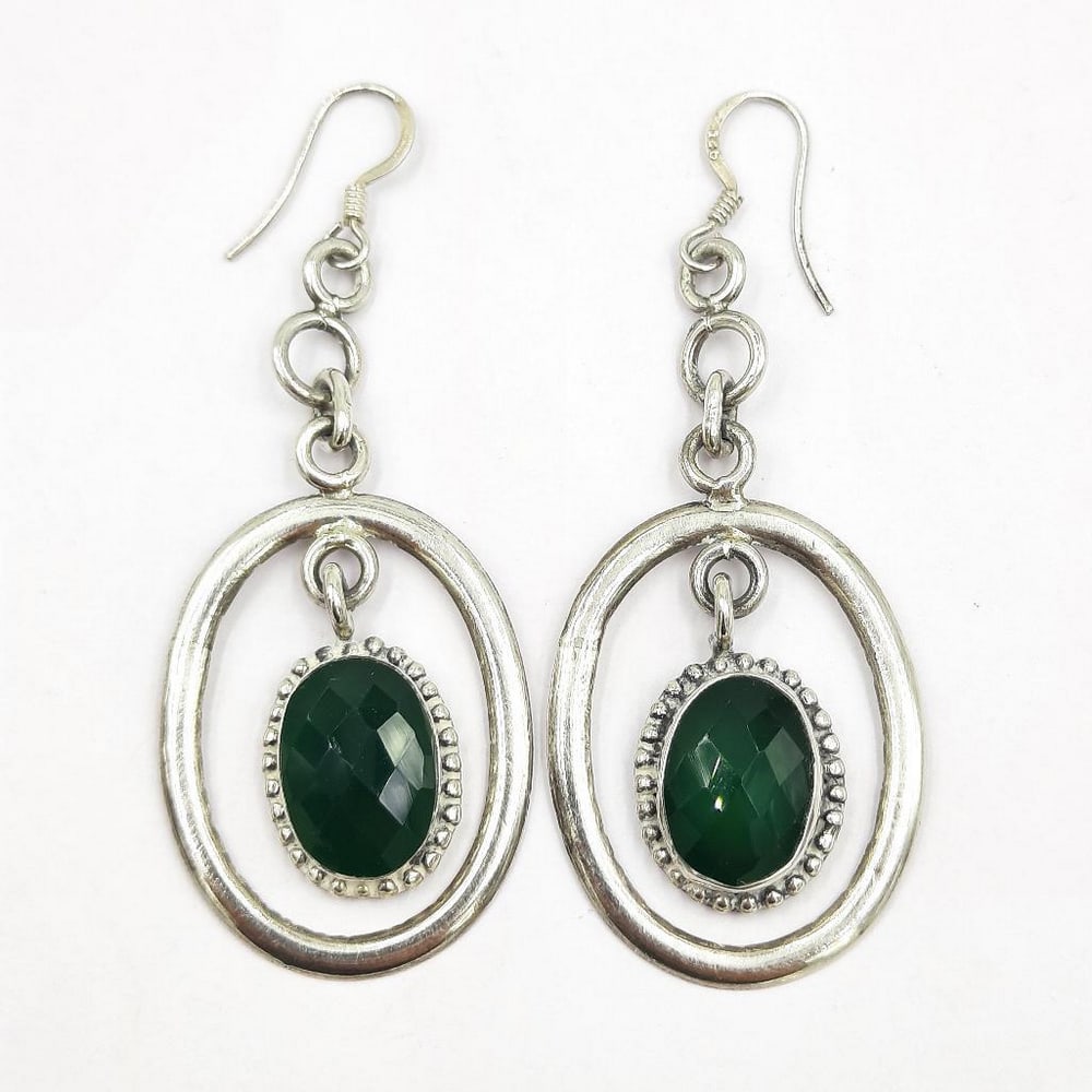 Circled Green Agate Earrings: Circled Green Agate Earrings These sterling silver earrings feature green agate dangling in the middle of an oval. The backing is a hook. View Photos For Further Details