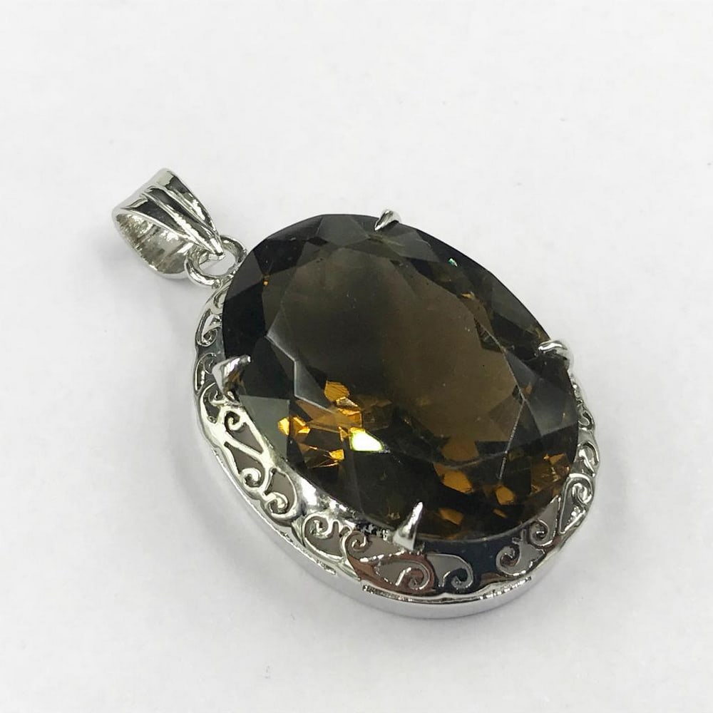 Large Smoky Quartz Necklace Pendant: Large Smoky Quartz Necklace Pendant This necklace pendant features sterling silver accents. View Photos For Further Details.