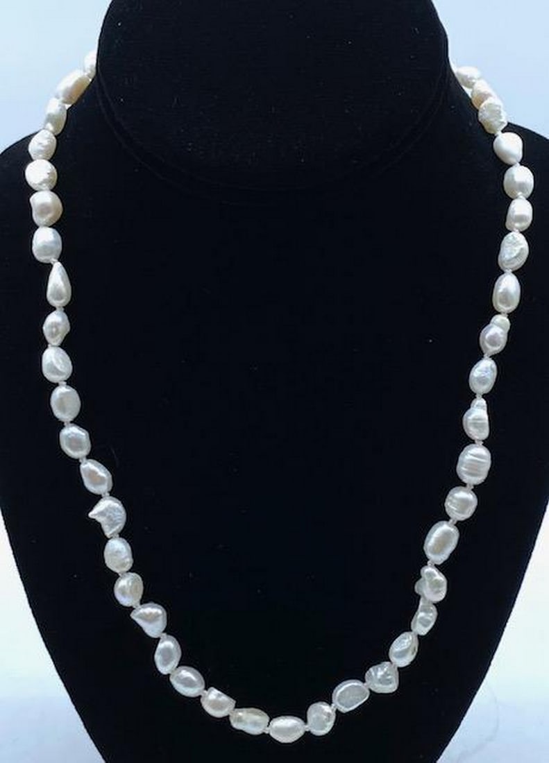 20" Genuine 7mm-8mm White Baroque Cultured Pearl Necklace: 20" Genuine 7mm-8mm White Baroque Cultured Pearl Necklace. A Striking White Luster Comes From Each Of The Baroque Pearls On This Hand Made Necklace. Necklace Length: 20" Inches Pearl Type: