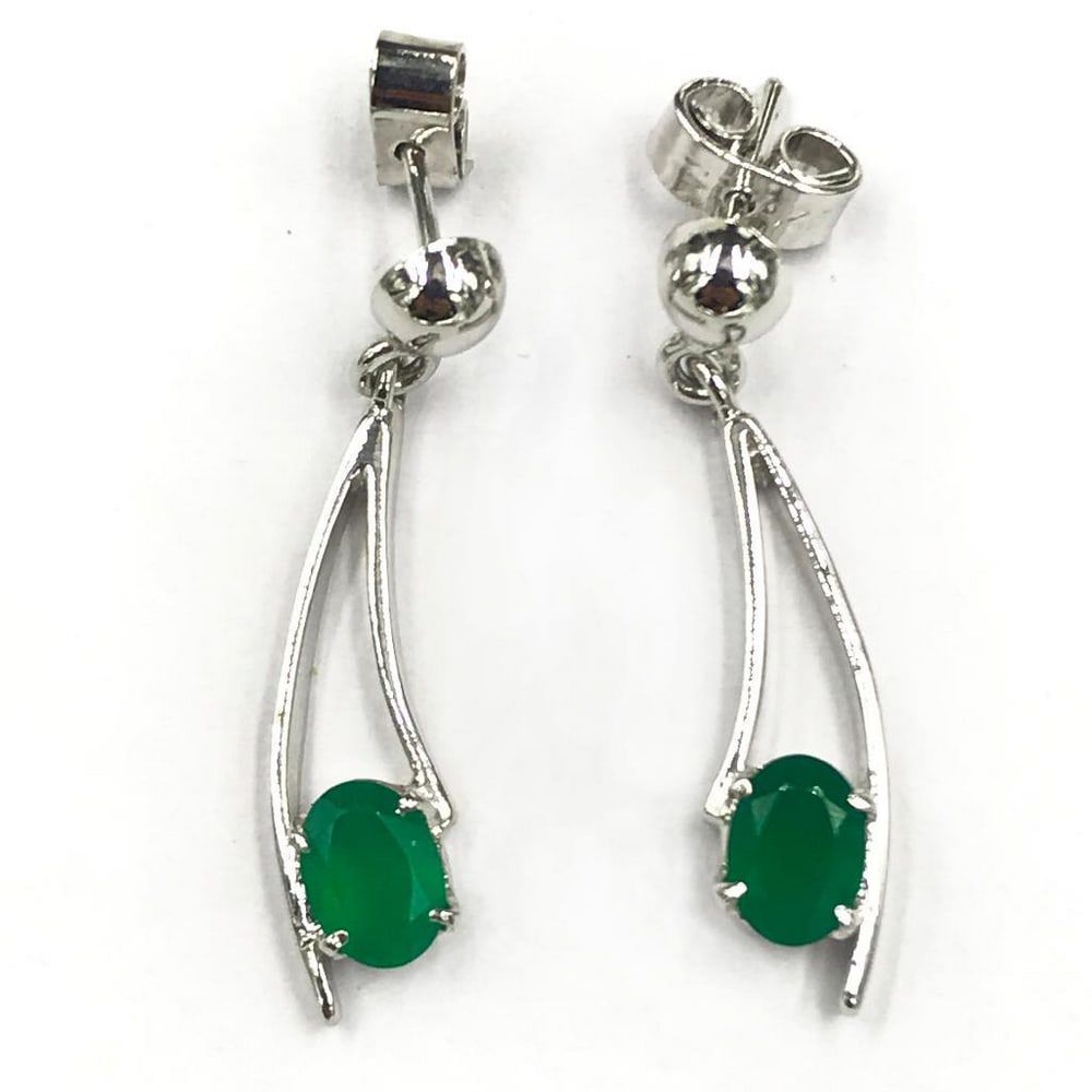 Enclosed Green Onyx Dangle Earrings: Enclosed Green Onyx Dangle Earrings Green onyx is said to represent intelligence, elevated brain power, and enhanced memory. It is a stunning deep green colour that can be the perfect accessory. View 