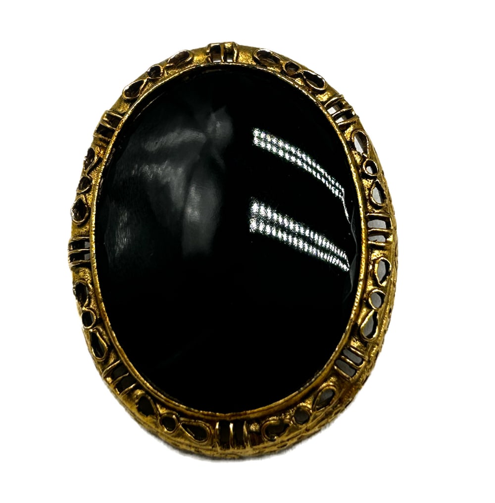 Simplistic Black and Gold Accent Brooch: Simplistic Black and Gold Accent Brooch This minimalist yet striking brooch features a classic black enamel face adorned with delicate gold accents, creating a captivating contrast that effortlessly