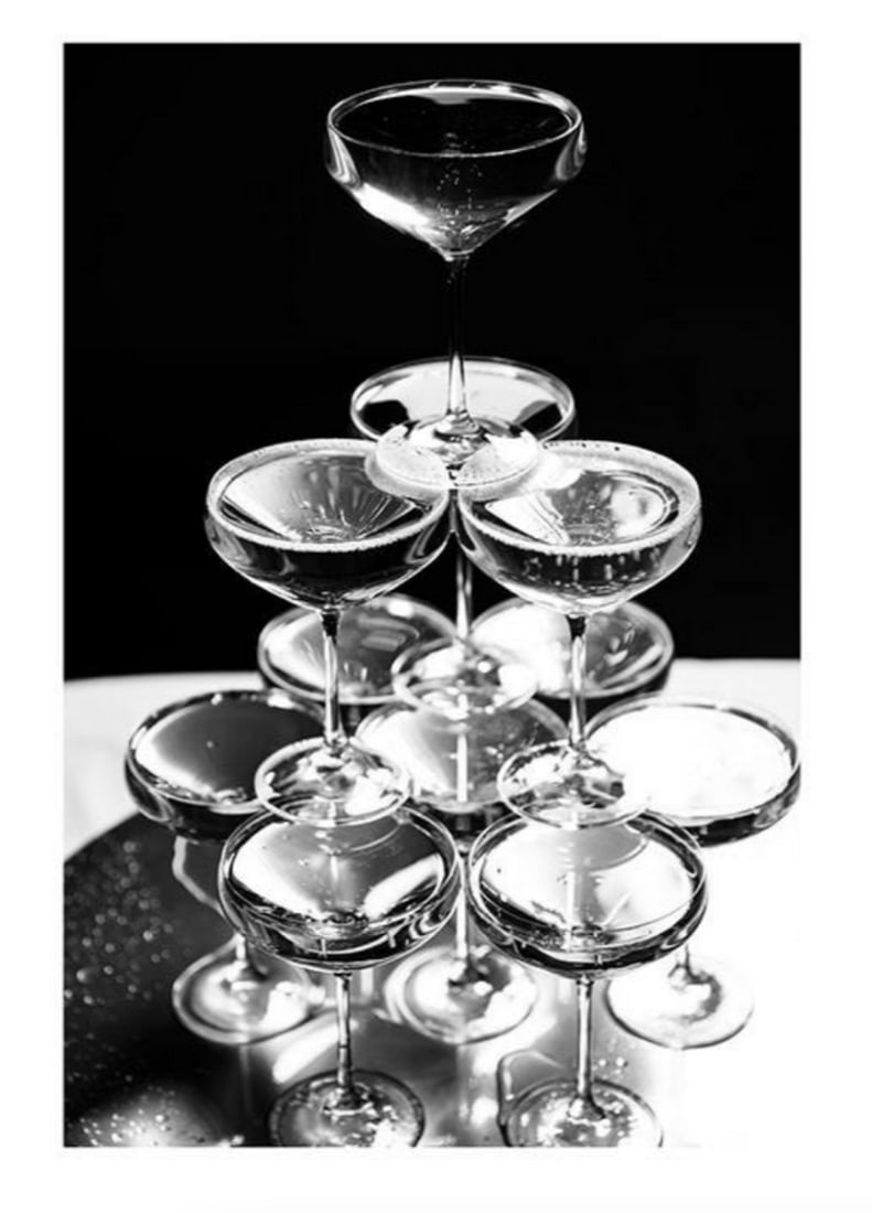 Black & White Champagne Tower Poster: Black & White Champagne Tower Poster Poster with a white border which elegantly frames the design. Frame Not Included Dimensions: 50cm x 70cm View Photos For Further Details.