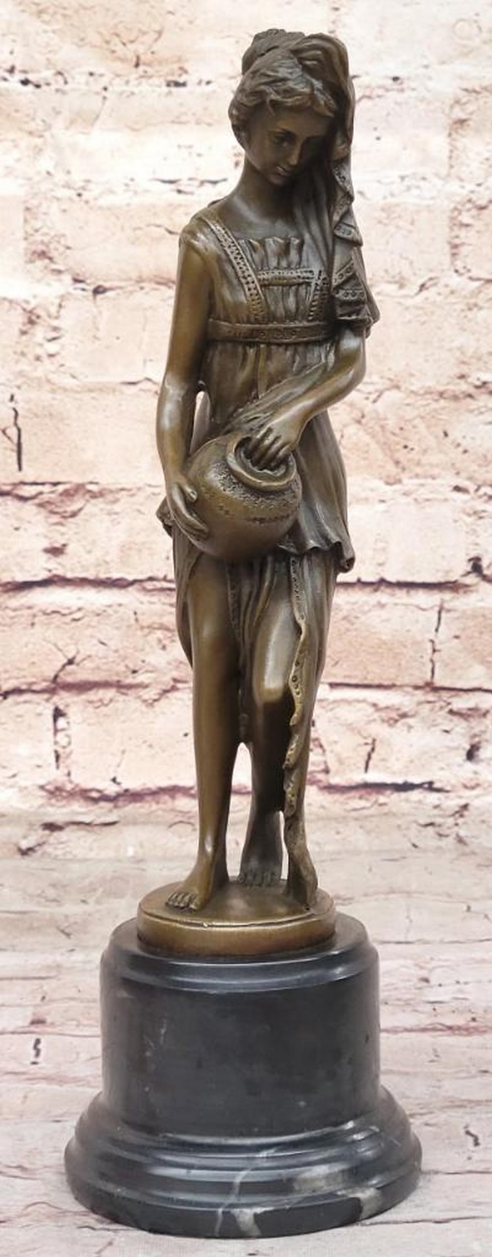 Bronze Greek Goddess Pouring Water Sculpture by Milo - 12.5" x 4": Bronze Greek Goddess Pouring Water Sculpture by Milo - 12.5" x 4" This exquisite bronze sculpture by Milo captures the timeless elegance of a Greek goddess adorned in a flowing Peplos. With in