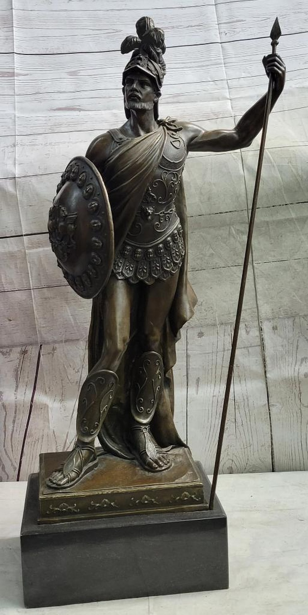 Bronze Roman Knight Sculpture Inspired by Dalou - 30" x 15": Bronze Roman Knight Sculpture Inspired by Dalou - 30" x 15" This stunning bronze sculpture immortalizes the valor and unwavering spirit of a Roman knight. Standing proudly, his glistening armo